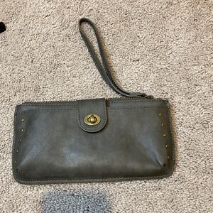 A dark green wallet with Gold accents